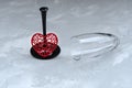 Small red heart and broken wine glass. Broken love, depression and hopelessness concept Royalty Free Stock Photo