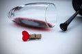 Small red heart in a broken wine glass. Broken love, depression and hopelessness concept Royalty Free Stock Photo