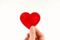 Small red heart in female hand, world heart day, world donor day Royalty Free Stock Photo