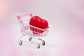 The small red heart puti n shopping cart