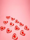 small red hearts on a soft pink colored background, copy space. Valentine's Day concept for design Royalty Free Stock Photo