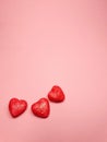 small red hearts on a soft pink colored background, copy space. Valentine's Day concept for design Royalty Free Stock Photo