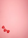 small red hearts on a soft pink colored background, copy space. Valentine's Day concept for design Royalty Free Stock Photo