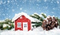 Small red house model covered with snow Royalty Free Stock Photo