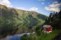 Small red house near the lake in Vestland, Norway Royalty Free Stock Photo