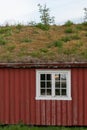 A small red house with a turf roof in Lofoten, Norway Royalty Free Stock Photo
