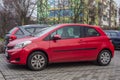 Small red Japanese car Toyota Yaris parked