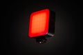Small red LED light panel isolated on dark background for creative lighting Royalty Free Stock Photo