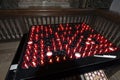 Small red lit church prayer candles Royalty Free Stock Photo