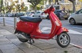 Small red motorbike parked on Tel-Aviv street Royalty Free Stock Photo