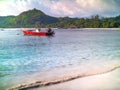 Small red motorboat anchored off a Seychelles beach on a sunny y Royalty Free Stock Photo