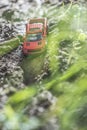 Small red off road car toy in the nature Royalty Free Stock Photo