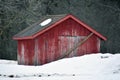 Small Red Outbuilding Barn in the Snow Royalty Free Stock Photo