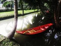 Small red paddle boat in the pond Royalty Free Stock Photo