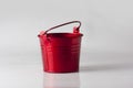 Small red decorative pail on the white background Royalty Free Stock Photo