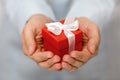 Small red present box in hands Royalty Free Stock Photo