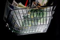 Small red shopping basket full of euro banknotes. Finance. Financial crisis. Banking system. Economic problem. Inflation. Royalty Free Stock Photo