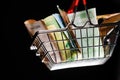 Small red shopping basket full of euro banknotes. Finance. Financial crisis. Banking system. Economic problem. Inflation. Royalty Free Stock Photo