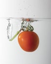 small red tomato drop in water with a splash Royalty Free Stock Photo