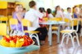 Small red tomatoes and sliced yellow pepper on children holiday