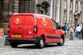 Small red van Peugeot Partner of The Royal Mail British postal company in Edinburgh