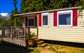 Small red and white cottage hut in the garden in Voula Greece Royalty Free Stock Photo