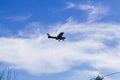 Small Red And White Prop Plane In Blue Sky With Clouds Royalty Free Stock Photo