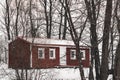 A small red wooden house in the forest Royalty Free Stock Photo