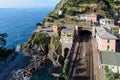 Small regional train station, located between mountains, at Riomaggiore town in Cinque Terre national park, Italy Royalty Free Stock Photo