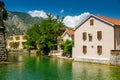 Small residential houses by the river Scurda in the old town of Kotor Royalty Free Stock Photo