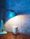 Small rest corner in house, Vintage style interior with iced coffee, old lamp on wooden table Royalty Free Stock Photo