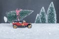 Small retro car with Christmas tree