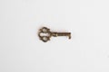 Small retro key isolated on white background Royalty Free Stock Photo