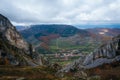 Small Rimetea village in Romania surrounded by the big mountains and forests on a gloomy day