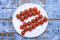 Small ripe red sweet cherry tomatoes on twig Royalty Free Stock Photo