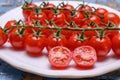 Small ripe red sweet cherry tomatoes on twig Royalty Free Stock Photo