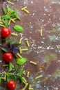 Small ripe tomatoes, fresh basil ,pasta top view Royalty Free Stock Photo