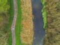 Small river and walking path in a park, Aerial top down view Royalty Free Stock Photo
