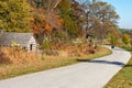 A Small Road With a Log Cabin Next to It at Valley Forge National Historical Park Royalty Free Stock Photo