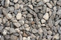 Small road stone background, dark gravel pebbles stone texture. Closeup top view gravel. Gravel in garden. Pattern