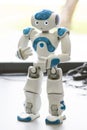 Small robot with human face and body. AI