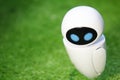 A small robot with a humanoid body on an isolated green background . Artificial intelligence-AI.