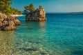 Small rock island and turquoise sea in Dalmatia, Brela, Croatia Royalty Free Stock Photo