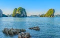 Small rocks lay in front of towering karsts in Halong Bay Vietnam Royalty Free Stock Photo