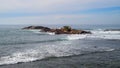 Small rocky island formation in the Indian ocean, Scenic seascape photograph high angle view