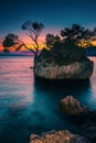 Small rocky island in the sea at sunset, Brela, Croatia Royalty Free Stock Photo