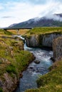 Rocky Ridge With River Flowing Through And Small Waterfall Under Bridge Royalty Free Stock Photo