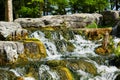 Small rocky waterfall on a sunny day Royalty Free Stock Photo