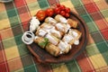 Small rolled pies with sour cream Royalty Free Stock Photo