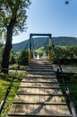 Small rope bridge over the river. Royalty Free Stock Photo
